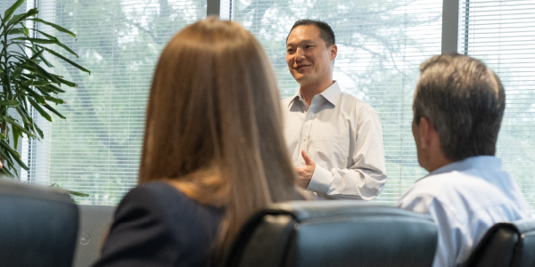 Man presenting to group of people
